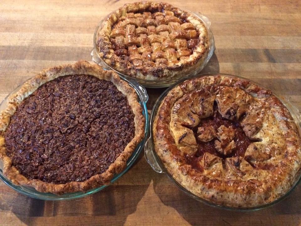 Picture of three pies, decorated differently.