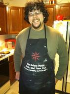 An old picture of the author, heavier with a black apron.