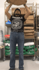 Animated GIF of the author demonstrating an Overhead Press with a sack of flour