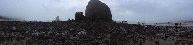 A panoramic shot of Cannon Beach and Haystack Rock in Oregon