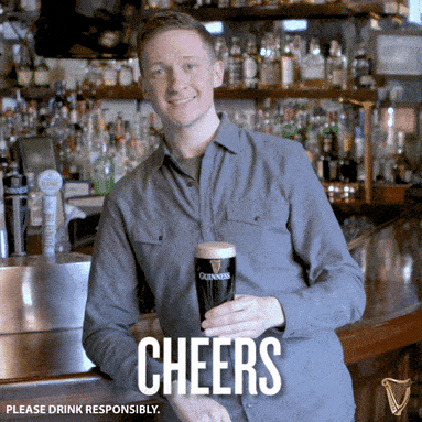 Animated GIF of a man toasting with a pint of Guinness