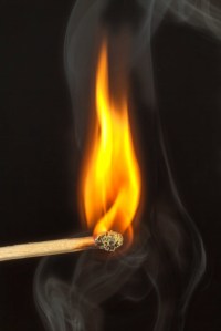 Close up of a burning match