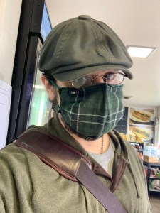The author in a green face mask waiting for his sandwich at House of Banh Mi
