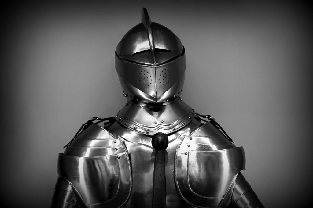 A suit of armor on a black-gray vignette background